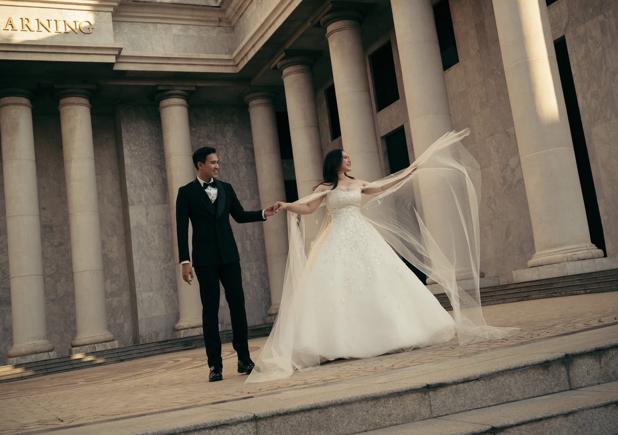 Couple before a classical colonnade
