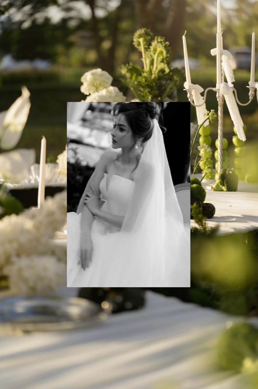 Bridal portrait framed against a candlelit table setting
